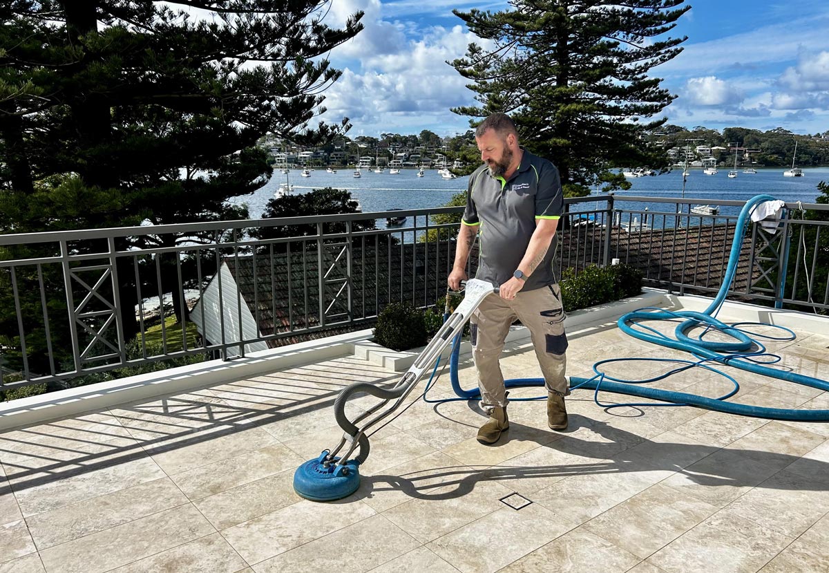 A Hamilton's technician restoring a marble floor in a Sydney home