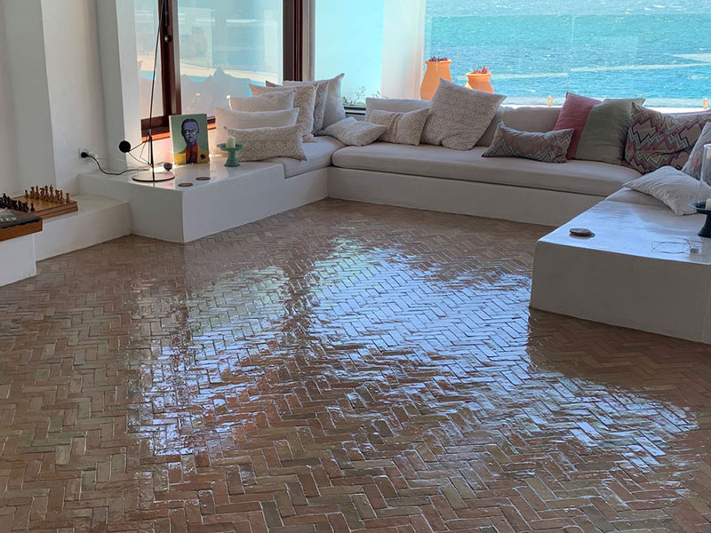 Sealer being applied to a cleaned stone floor